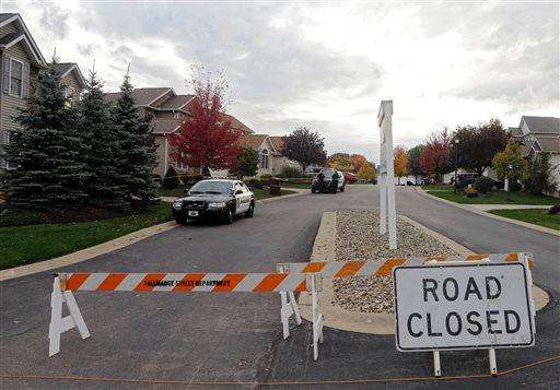  
              Tallmadge police cordon off a home in Tallmadge, Ohio, Wednesday, Oct. 15, 2014, where Amber Joy Vinson stayed over the weekend before flying home to Dallas. Vinson, a nurse who helped care for Thomas Eric Duncan, has also been diagnosed with the Ebola virus. (AP Photo/Mark Duncan)
             