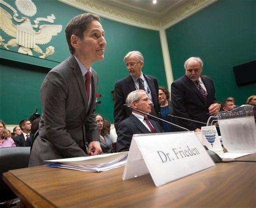  
              Centers for Disease Control and Prevention (CDC) Director Dr. Tom Frieden, left, takes his seat on Capitol Hill in Washington, Thursday, Oct. 16, 2014, prior to testifying before the House Energy and Commerce Committee's subcommittee on Oversight and Investigations, to get answers about the Ebola outbreak from top U.S. health officials.  (AP Photo/Pablo Martinez Monsivais)
             