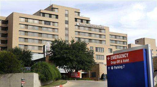  
              FILE - In this Oct. 8, 2014, file photo, a sign points to the emergency room entrance at Texas Health Presbyterian Hospital, where U.S. Ebola patient Thomas Eric Duncan was being treated, in Dallas. Duncan's records show that for days after he was admitted for Ebola, his caregivers were vulnerable to the deadly virus. (AP Photo/LM Otero, File)
             