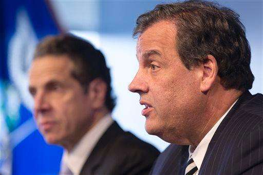  
              New York Governor Andrew Cuomo, left, listens as New Jersey Governor Chris Christie talks at a news conference, Friday, Oct. 24, 2014 in New York. The governors announced a mandatory quarantine for people returning to the United States through airports in New York and New Jersey who are deemed 