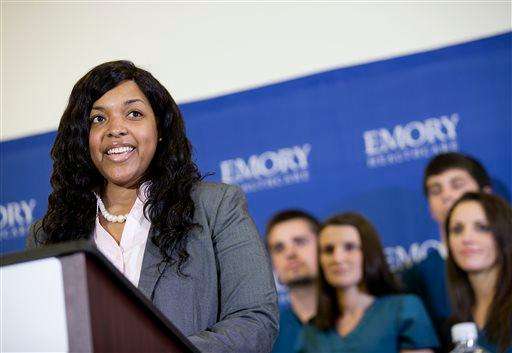  
              Amber Vinson, 29, the Dallas nurse who was being treated for Ebola, speaks at a news conference as members of her nursing staff look on after being discharged from Emory University Hospital, Tuesday, Oct. 28, 2014, in Atlanta. Vinson worked as a nurse at Texas Health Presbyterian Hospital Dallas and cared for Thomas Eric Duncan, a Liberian man who died of Ebola at the hospital on Oct. 8. Vinson was one of two nurses who became infected while caring for Duncan. (AP Photo/David Goldman)
             