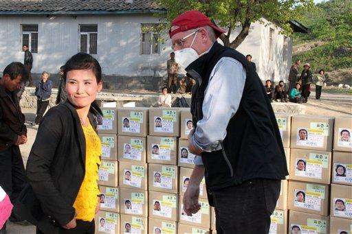  
              This undated handout photo provided by the Eugene Bell Foundation (EBF), shows John Rogers, executive director of the Eugene Bell Foundation, right, preparing to distribute tuberculosis medication to patients at a TB treatment center in Ryokpo, North Korea. Despite worsening U.S.-North Korean relations, an American charity is ramping up efforts against an epidemic of multidrug-resistant tuberculosis in the isolated country, where it says it is making inroads in fighting the deadly disease. The Eugene Bell Foundation travels to North Korea twice-a-year, bringing high-end equipment and drugs to treat patients at old-world sanatoria that house sufferers of TB that has spread among a population weakened by malnutrition since a famine in the 1990s. The foundation goes again this month, on a whirlwind, three-week mission to help hundreds of patients.(AP Photo/Eugene Bell Foundation)
             