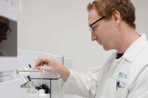 Dr Dominic Hare at work in his laboratory. Photo: George Ganio/UST