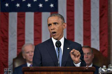 President Barack Obama delivers his State of the Union address to a joint session of Congress on Capitol Hill on Tuesday, Jan. 20, 2015, in Washington. Vice President Joe Biden and House Speaker John Boehner of Ohio, listen in the background. (AP Photo/Mandel Ngan)